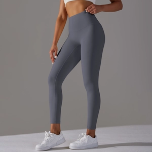 Close-up of high-waisted gray yoga pants showing seamless compression and body-sculpting fit