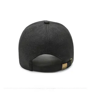 Detail of dark gray baseball cap with adjustable brass buckle and fabric strap on back