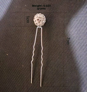 Detail of silver U-shaped bridal hair pin with 7cm length and 1cm rhinestone ball top