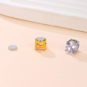 Macro shot of 6mm and 8mm magnetic zircon stud earrings in gold and silver plating