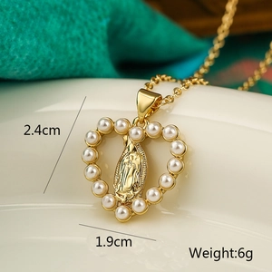 Detail view of heart-shaped pearl pendant with Virgin Mary relief and dimensions 2.4x1.9cm