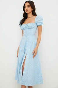 Detail of summer puff sleeve floral dress with front tie and high slit design