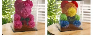 Detail of pink and rainbow PE foam rose bears in clear display gift boxes with ribbons