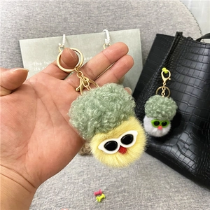 Creative cauliflower plush keychain with sunglasses shown as a cute handbag accessory