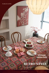 Macro shot of colorful geometric jacquard patterns on red festive vintage tablecloth