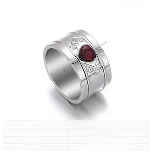 Macro shot of stainless steel ring featuring a red heart crystal and zircon arrows