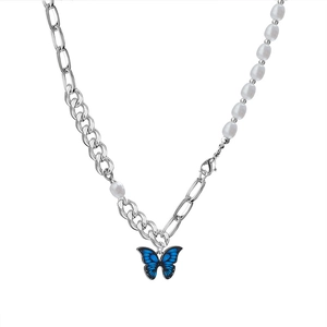 Baroque pearl necklace featuring a blue butterfly pendant and unique silver double chain