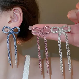 Elegant bow tassel drop earrings with sparkling crystals in blue pink and silver finish