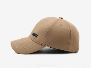 Detail view of khaki baseball cap side profile with AHYT embroidery and thick wool fabric