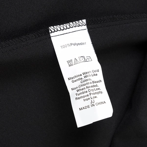 Detail view of garment care label showing 100% polyester fabric and washing instructions