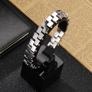 Close-up of dual-tone 18k vacuum plated men's steel bracelet with polished geometric links