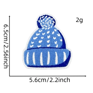 Detail showing dimensions of blue embroidered winter hat patch with snowflake pattern