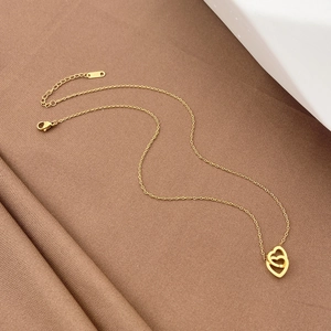 Minimalist gold stainless steel necklace featuring intertwined double heart pendants