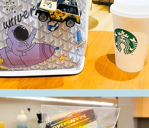 Detail of white tote with astronaut print and yellow camouflage jeep keychain pendant