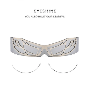 Detailed view of futuristic Y2K wrap sunglasses with gold mesh wing frames and silver mirrors