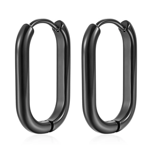 Macro shot of oval black stainless steel geometric earrings on white background