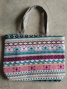 Top view of large canvas tote bag featuring bohemian geometric patterns and grey handles