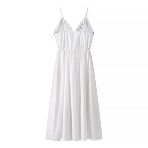 Back view of white backless embroidery midi dress with adjustable straps and elastic waist