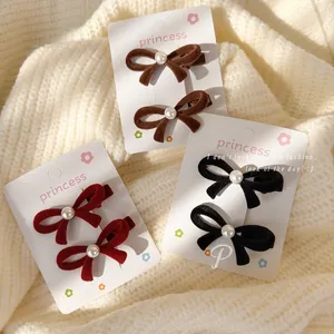 Flocked velvet bow hair clips with pearls in black, brown, and burgundy colors
