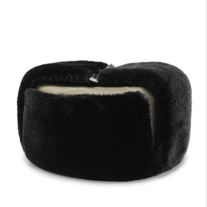 Close-up of winter trapper hat with thick black faux fur and khaki fabric detail