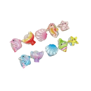 Handmade glitter ocean themed press-on nails for kids with cute resin animal charms