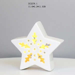 Star-shaped ceramic LED light with warm yellow glow and hollow patterns for home decor