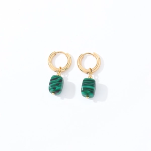 Close-up of geometric gold-plated hoops with rectangular green malachite stone pendants