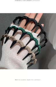 Detailed view of satin-wrapped non-slip headbands in black, dark green, and khaki