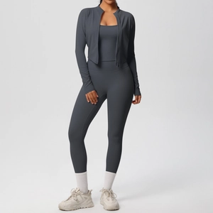Three-piece charcoal yoga set including zip-up jacket, cropped tank top, and high-waist leggings