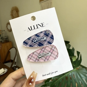Pink and navy blue plaid bow hair clips set on display card for women and girls
