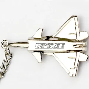 Silver metal fighter jet keychain with streamline design and engraved Chinese characters