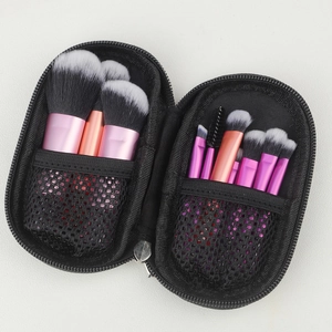 Detailed view of 10-piece travel makeup brush set with double-sided black mesh zipper pouch