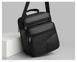 Detailed macro view showing the lychee texture leather and durable zipper pockets