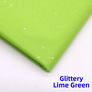 Detail of glitter fruit green wrapping paper with shiny sequins for floral bouquet DIY