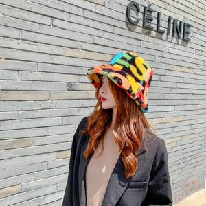 Close-up of colorful faux fur bucket hat with soft plush texture and abstract pattern