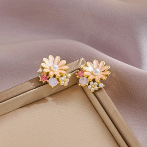 Summer daisy flower earrings with pink enamel and sparkling crystals on satin fabric