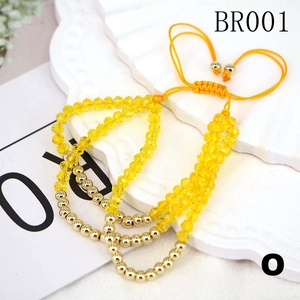 Adjustable crystal beaded bracelet with yellow faceted stones and gold accents