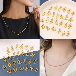 Gold stainless steel bead chain necklace featuring cursive A-Z letter pendants