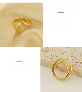 Macro shot of gold caterpillar textured ring showing spiral ribbed stainless steel details