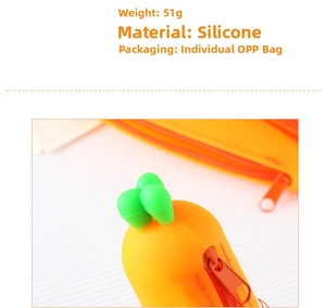 Detail view of orange silicone carrot pencil case showing zipper and green leaf top