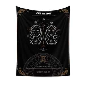 Detail view of black and gold Gemini zodiac tapestry with astrology symbols and dates