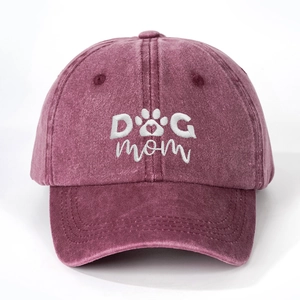 Vintage washed purple baseball cap featuring white DOG MOM embroidery and a cute paw print