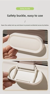 Close-up of the white safety buckle showing the secure locking mechanism on a storage box