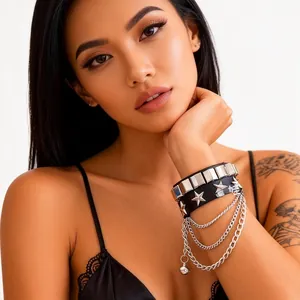 Detail of multilayer punk leather bracelet with silver studs, stars and metal chains