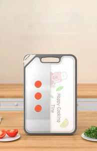 Dual-sided stainless steel and wheat fiber cutting board with non-slip edges in kitchen
