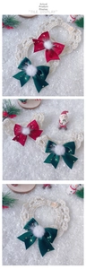 Detailed macro view of handmade crochet Christmas pet collar with festive red bow and gold stars