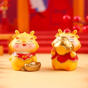 Macro view of resin cartoon figures with gold ingots and lucky wealth symbols
