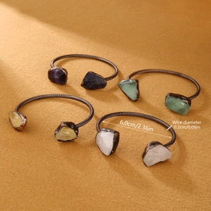 Vintage bronze open bracelet featuring assorted natural raw crystals in various colors