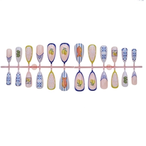 Almond press-on nails featuring leopard print, floral patterns, and lemon nail art designs