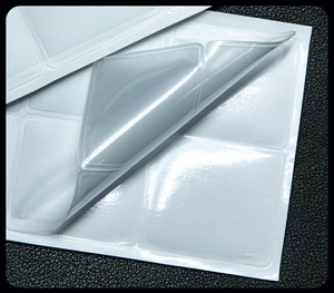 Macro shot of self-adhesive transparent PE pads with honeycomb texture and strong grip